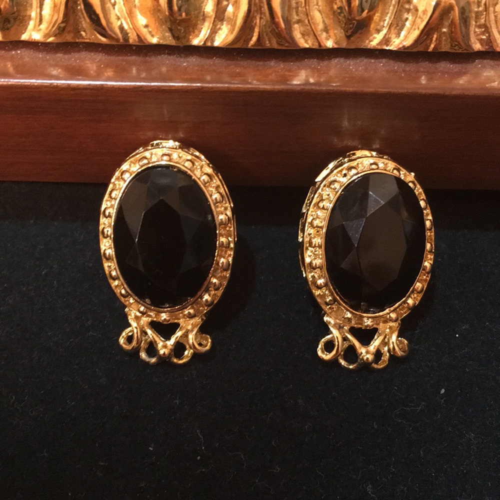 Gold tone Black Stone stud earrings.